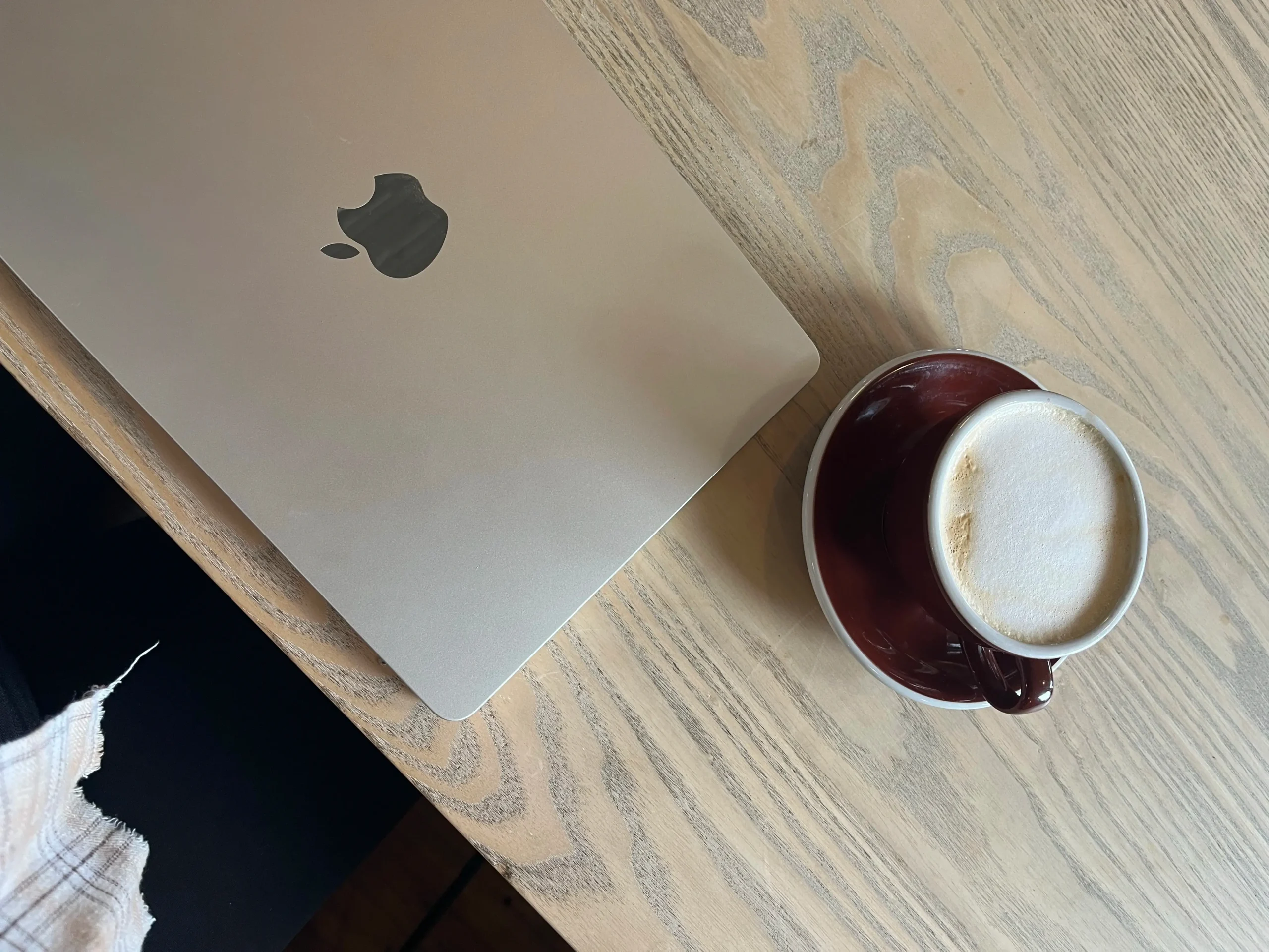 a laptop and a cup of coffee on a table